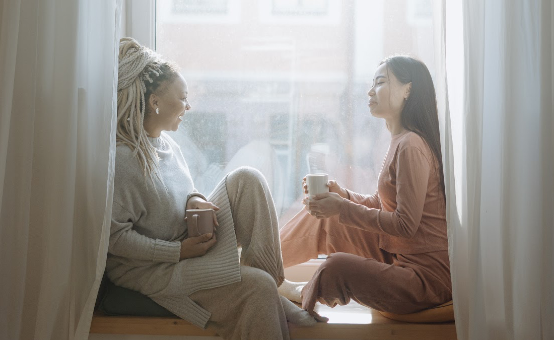 two women with mugs recovering from burnout